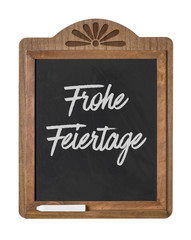 Obraz premium Kreidetafel mit der Beschriftung Frohe Feiertage