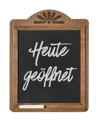 Kreidetafel mit der Beschriftung Heute geöffnet
