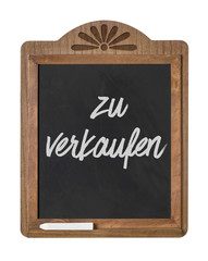 Fototapeta premium Kreidetafel mit der Beschriftung Zu verkaufen