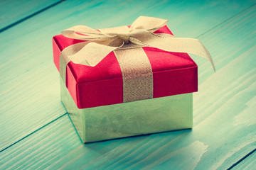 Gift on blue wooden background