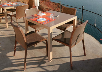 outdoor cafe on terrace over sea coast, Santorini