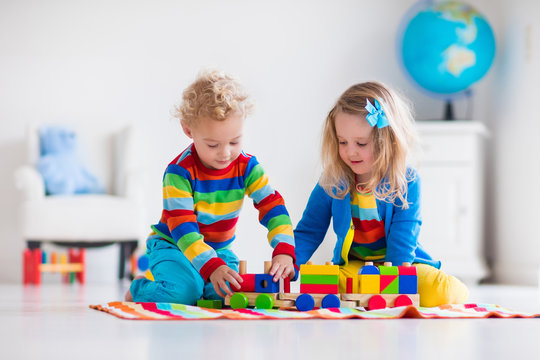 Kids Playing With Wooden Toy Train