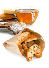image of a cup of tea and cookies on a white background close-up