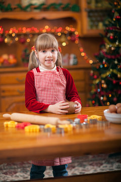Little girl preparing Christmas cookies