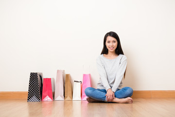 Woman with shopping bag in home