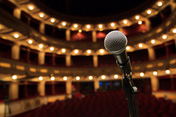 Close up of microphone in concert hall - obrazy, fototapety, plakaty