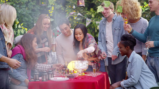  Freshly cooked food from the bbq is served to friends at outdoor party