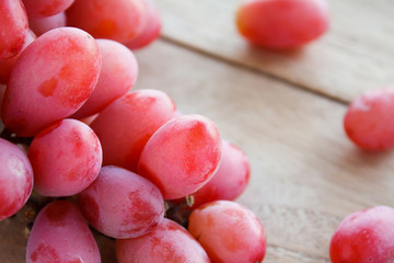red grapes on wooden background