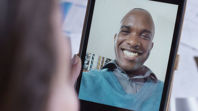  Young businessman in a video conference call with a collegue