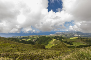 Azores landscape scenery in summer with white clouds and ocean