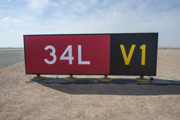 Directional sign markings by a runway