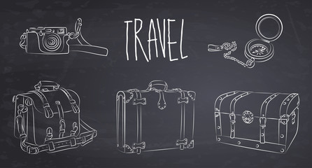 Fototapeta premium Hand drawn old suitcase, travel bag, chest, compass and camera onthe chalkboard. Vector illustration.