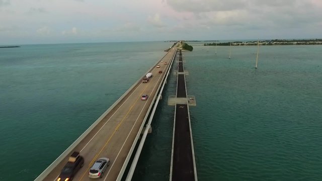 Aerial view of ocean and bridge with cars passing on Overseas Highway in Florida Keys