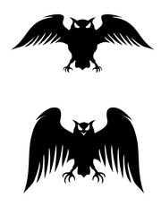Flying owls. Stylized logo silhouettes. Vector eps8 isolated on