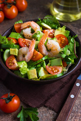 salad with avocado and shrimps in bowl