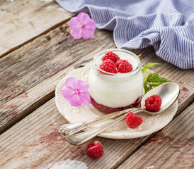 Natural yogurt with fresh raspberries