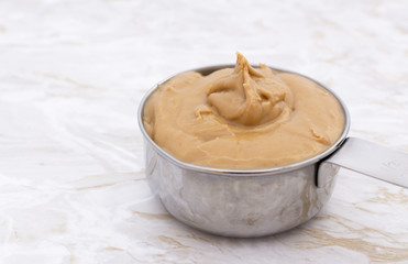 Peanut butter in a measuring cup