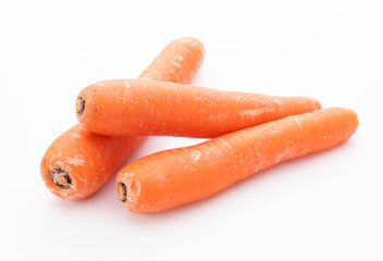 whole carrots and cutl isolated on white
