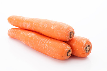 whole carrots and cutl isolated on white
