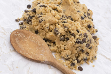 Wooden spoon with chocolate chip cookie dough