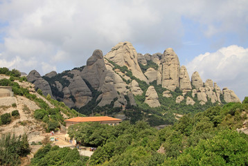 MONTSERRAT, SPAIN - AUGUST 28, 2012: Montserrat mountains near Benedictine abbey Santa Maria de Montserrat in Monistrol de Montserrat, Spain