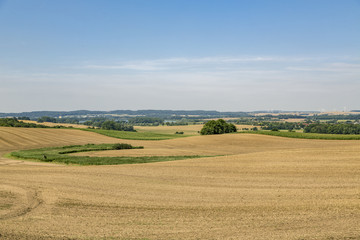 Fototapeta na wymiar H'DR landscape with fields and cloudscape in summer