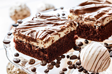 pieces of filled cake with chocolate icing