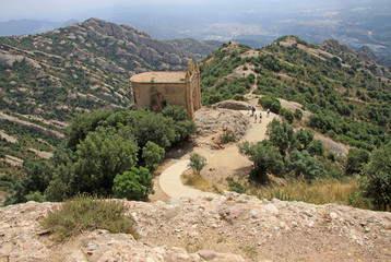Fototapeta premium MONTSERRAT, SPAIN - AUGUST 28, 2012: Saint Joan hermitage in Montserrat Mountain, Spain. Benedictine abbey Santa Maria de Montserrat in Monistrol de Montserrat