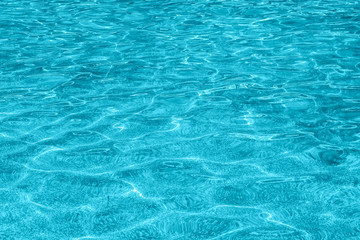 Blue ripple water surface with reflection
