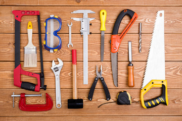 Hand tools on wood background 