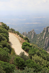 MONTSERRAT, SPAIN - AUGUST 28, 2012: Hiking paths in the mountains near Benedictine abbey Santa Maria de Montserrat in Monistrol de Montserrat, Spain