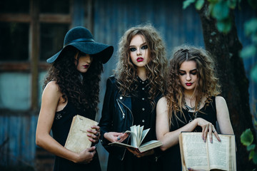 three vintage women as witches