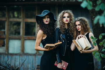 three vintage women as witches