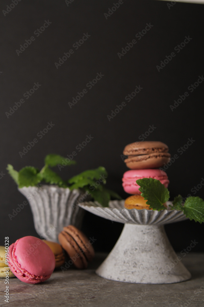 Wall mural macarons in gray vintage vase with mint. on a gray stone backgro