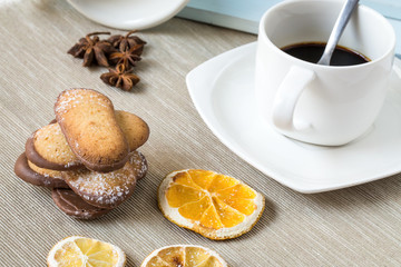 Assorted Cookies and coffee on wooden table