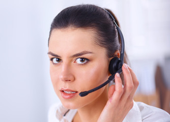 Close-up portrait of a customer service agent sitting at office