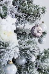Fototapeta na wymiar Ball on christmas tree with snow