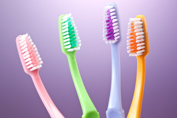 a group of colorful toothbrushes