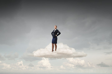 Successful businesswoman on cloud
