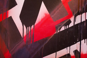 Red on black graffiti detail - 97970140