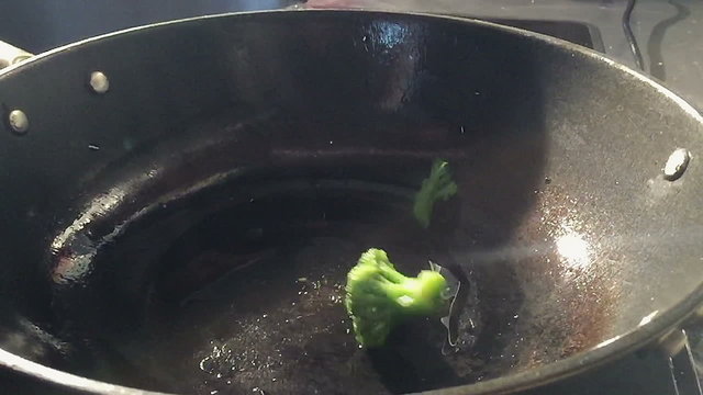 Broccoli Flying Mid Air, Being Flipped From A Frying Pan