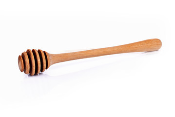 Wooden Spoon honey on white background