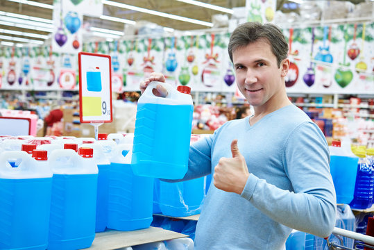 Man buys nonfreezing liquid in supermarket