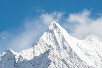 Fototapeta na wymiar Mountain peak with snow