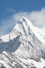 Fototapeta na wymiar Mountain peak with snow