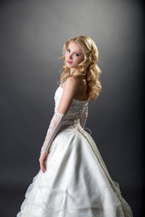 Pretty girl posing in beautiful wedding dress