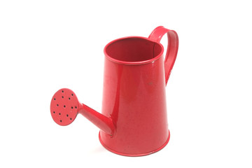Red watering can isolated on white background