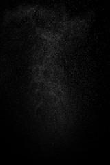 Abstract splashes and drops of water on black background.