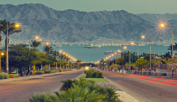 View on the Red Sea from a local street in Eilat after sunset, Israel. Image toned for inspiration of retro style