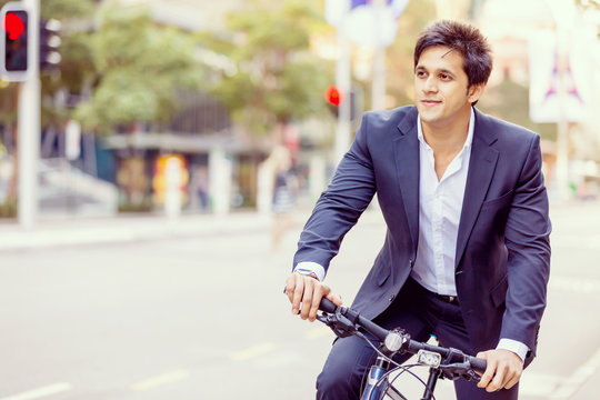 Successful Businessman Riding Bicycle